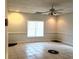 Well-lit room with tile flooring, a ceiling fan, and decorative floor elements at 3306 Chastain Ridge Dr, Marietta, GA 30066