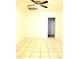 Spacious room with tile flooring, a ceiling fan, and a doorway at 3306 Chastain Ridge Dr, Marietta, GA 30066