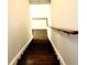 Staircase with wooden steps and white risers, featuring a wooden handrail at 3306 Chastain Ridge Dr, Marietta, GA 30066