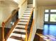 Staircase with hardwood treads and decorative black iron railing at 3306 Chastain Ridge Dr, Marietta, GA 30066