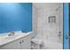 Updated bathroom features a white vanity and a modern tiled shower-tub combo at 4064 Post Rd, Winston, GA 30187