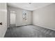 Bedroom featuring neutral paint, gray carpet, and a door leading to another bedroom at 4064 Post Rd, Winston, GA 30187