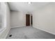 Bedroom features gray carpet, neutral paint, and bright window for natural light at 4064 Post Rd, Winston, GA 30187