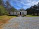 Front view of the house showcasing the front door and wooden deck at 4064 Post Rd, Winston, GA 30187