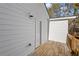 Side view of the home with the deck showing durable siding and a wooden railing and trim at 4064 Post Rd, Winston, GA 30187