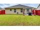 Spacious backyard with well-maintained lawn and outdoor patio area, great for enjoying the outdoors at 10892 Big Sky Dr, Hampton, GA 30228