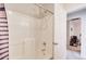 Clean bathroom featuring a shower and a doorway to an adjacent room, offering a practical layout at 10892 Big Sky Dr, Hampton, GA 30228