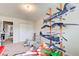 Interesting bedroom with an aviation theme and model airplanes and an adjacent room through the doorway at 10892 Big Sky Dr, Hampton, GA 30228
