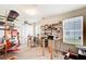 Interesting bedroom featuring an aviation theme, model airplanes, work benches, and natural light at 10892 Big Sky Dr, Hampton, GA 30228