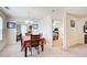 Light dining area with access to backyard and view into large living room at 10892 Big Sky Dr, Hampton, GA 30228