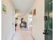 Inviting entrance hallway, leading to a well-lit living area, creating a warm and welcoming atmosphere at 10892 Big Sky Dr, Hampton, GA 30228