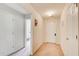 Neutral-toned hallway with multiple doors, offering access to various rooms within the home at 10892 Big Sky Dr, Hampton, GA 30228