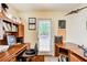 Functional office space with built-in bookshelves, ample desk space, and natural light at 10892 Big Sky Dr, Hampton, GA 30228
