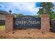 Sign for the Lovejoy Station Community featuring a brick base and decorative accents at 10892 Big Sky Dr, Hampton, GA 30228