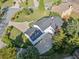 Aerial view of a well-manicured lawn and backyard of this home, showcasing the roof and surrounding landscaping at 1435 Willis Lake Nw Dr, Kennesaw, GA 30152
