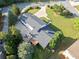 Aerial view showcases home's roof, lawn, outdoor deck, seating, and mature landscaping, highlighting the property's curb appeal at 1435 Willis Lake Nw Dr, Kennesaw, GA 30152
