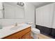 The bathroom features a standard toilet, a single sink, and a shower with a curtain at 1435 Willis Lake Nw Dr, Kennesaw, GA 30152