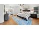 Cozy bedroom featuring neutral decor, a ceiling fan, and an area rug at 1435 Willis Lake Nw Dr, Kennesaw, GA 30152