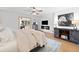 Modern bedroom with shiplap accent wall, TV, and cozy furnishings at 1435 Willis Lake Nw Dr, Kennesaw, GA 30152