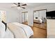Bedroom boasts hardwood floors, mirrored closet doors, and a ceiling fan at 1435 Willis Lake Nw Dr, Kennesaw, GA 30152