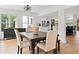 Dining area with hardwood floors featuring a wooden table and access to the kitchen at 1435 Willis Lake Nw Dr, Kennesaw, GA 30152