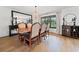 Warm dining room with hardwood floors, traditional furnishings, and a window view at 1435 Willis Lake Nw Dr, Kennesaw, GA 30152