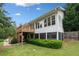 The house features an inviting exterior with a deck, screened in porch and landscaped yard at 1435 Willis Lake Nw Dr, Kennesaw, GA 30152