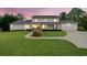Stunning view of this home featuring a sprawling lawn, covered porch, and a well-maintained exterior with a driveway and garage at 1435 Willis Lake Nw Dr, Kennesaw, GA 30152