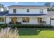 Inviting two-story white home with a welcoming porch and a swing, perfect for enjoying the outdoors at 1435 Willis Lake Nw Dr, Kennesaw, GA 30152