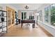 Bright home office with hardwood floors, a desk, and French doors that lead to the main living spaces at 1435 Willis Lake Nw Dr, Kennesaw, GA 30152