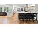 Spacious kitchen with a large island, modern appliances, and hardwood floors flowing into an open layout at 1435 Willis Lake Nw Dr, Kennesaw, GA 30152