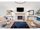 Cozy living room featuring a fireplace, hardwood floors, and elegant decor at 1435 Willis Lake Nw Dr, Kennesaw, GA 30152