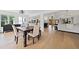 Open-concept living and dining area boasts hardwood floors and abundant natural light at 1435 Willis Lake Nw Dr, Kennesaw, GA 30152