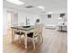Brightly lit living room features sleek furniture and seamlessly connects to the dining area at 1435 Willis Lake Nw Dr, Kennesaw, GA 30152