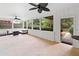 The screened porch features comfortable seating, fan, and views of the beautiful backyard at 1435 Willis Lake Nw Dr, Kennesaw, GA 30152