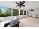 The screened porch offers comfortable seating, fan, and views of the backyard at 1435 Willis Lake Nw Dr, Kennesaw, GA 30152