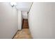 Unfinished basement stairway with wooden steps and white walls at 3331 Lockwood Sw Ct, Lilburn, GA 30047
