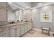 Bathroom with double vanity, granite countertops, and stained glass window at 3331 Lockwood Sw Ct, Lilburn, GA 30047