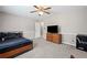 Bedroom featuring a dark ceiling fan, trim package, and ample space at 3331 Lockwood Sw Ct, Lilburn, GA 30047