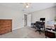 Bedroom features a ceiling fan, desk, and ample space at 3331 Lockwood Sw Ct, Lilburn, GA 30047