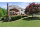 A charming home featuring a large deck with an adjacent screened porch perfect for entertaining and enjoying the outdoors at 3331 Lockwood Sw Ct, Lilburn, GA 30047