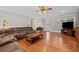 Spacious living room with hardwood floors, large windows, and a comfortable seating area for relaxation and entertainment at 3331 Lockwood Sw Ct, Lilburn, GA 30047