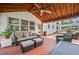 Outdoor living with comfortable seating and wooden ceiling at 3331 Lockwood Sw Ct, Lilburn, GA 30047