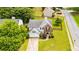 Aerial view of a home with a two-car garage, manicured lawn, and mature trees at 3471 Chastain Glen Ne Ln, Marietta, GA 30066