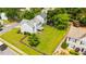A large, grassy, fenced backyard with mature trees provides privacy and space at 3471 Chastain Glen Ne Ln, Marietta, GA 30066