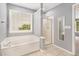 Bathroom featuring a soaking tub and separate shower at 3471 Chastain Glen Ne Ln, Marietta, GA 30066