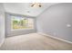 Bright bedroom with neutral carpet, vaulted ceiling and a large window at 3471 Chastain Glen Ne Ln, Marietta, GA 30066