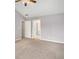 Neutral-carpeted bedroom with vaulted ceiling, fan, and doorways to other rooms at 3471 Chastain Glen Ne Ln, Marietta, GA 30066
