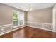 Dining room with hardwood floors, a chandelier, wainscoting, and a large window at 3471 Chastain Glen Ne Ln, Marietta, GA 30066