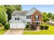 Charming two-story home with a two-car garage, brick accents, and a well-kept lawn at 3471 Chastain Glen Ne Ln, Marietta, GA 30066